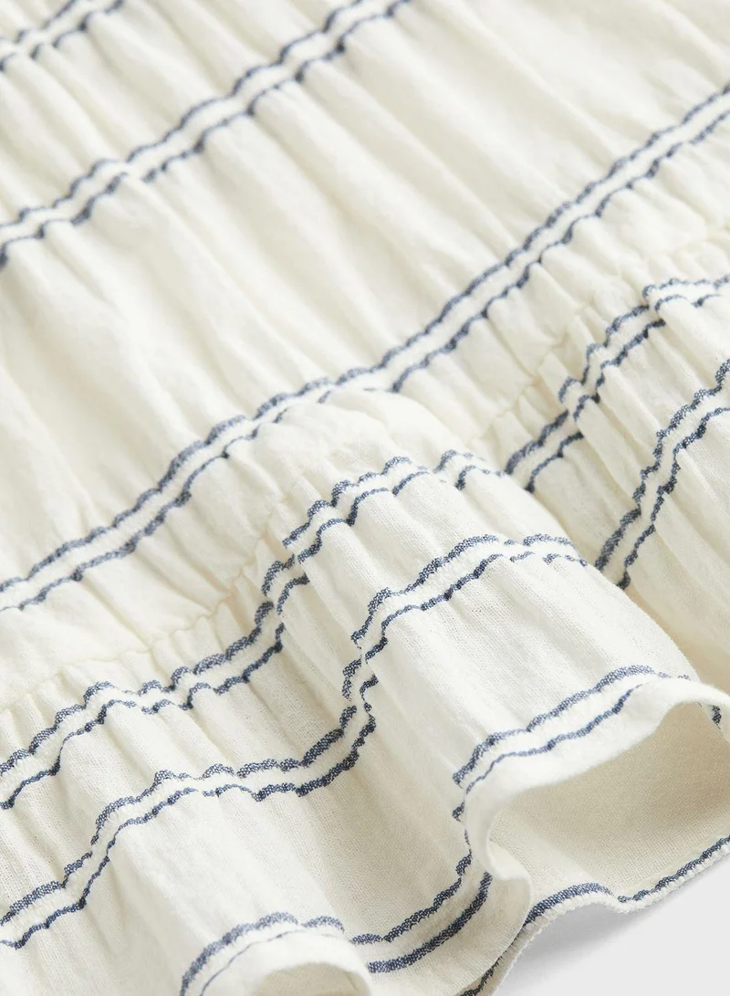 اتش اند ام تنورة متوسطة الطول من نسيج الجاكار